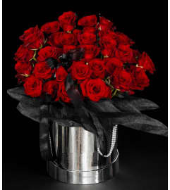 Rich Red Roses Treasure. An arrangement by Geni's Florist and Gifts.