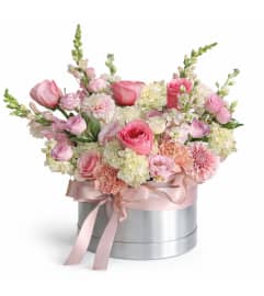 Gentle Whispers Bloom. An arrangement by Geni's Florist and Gifts.