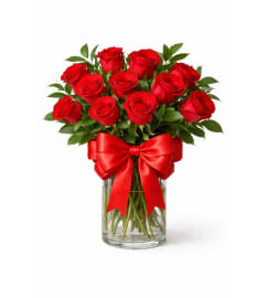 Devoted to Love. An arrangement by Geni's Florist and Gifts.