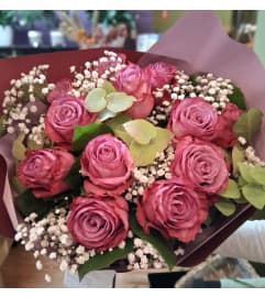 Dozen Hot pink Rose Bouquet. An arrangement by Sophie's Flowers.
