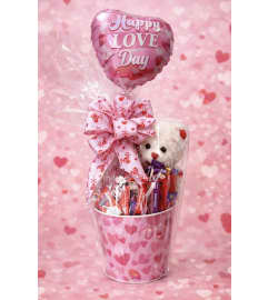 Valentine's Day Candy Basket (With 7 Plush Sitting Bear). An arrangement by Petals and Co..