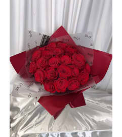 2DZ ROSES IN CLUTCH. An arrangement by M's Flowers.