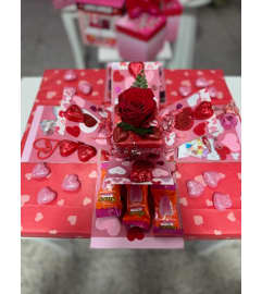 L Valentine Surprise Box. An arrangement by Bertha's Florist.