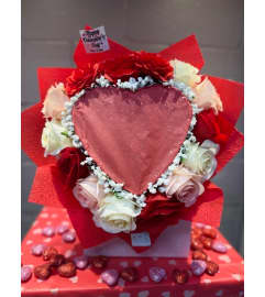 Red and White Burn Reveal Bouquet. An arrangement by Bertha's Florist.