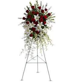 TF Lily and Rose Tribute Standing Spray. An arrangement by Nicol Florist.