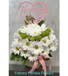 Blooming Birthday Cake by Fellows. An arrangement by Fellows Fernlea Flowers.