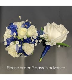 White and Blue Corsage Duo. An arrangement by Violeta's Flower Shop.