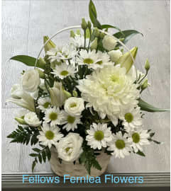 Enduring Light Basket by Fellows. An arrangement by Fellows Fernlea Flowers. Enduring Light Basket by Fellows. An arrangement by Fellows Fernlea Flowers.