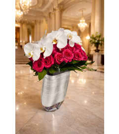 Phalaenopsis With Roses Eclictic. An arrangement by Brickell Exclusive Blooms. Phalaenopsis With Roses Eclictic. An arrangement by Brickell Exclusive Blooms.