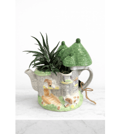 Vintage Teapot Planter (1 of a kind). An arrangement by Lori's Hearts and Flowers.