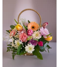 Spring Garden Basket. An arrangement by Avenida Flowers.