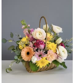 Spring Garden Basket. An arrangement by Avenida Flowers.