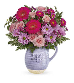 Teleflora's Pour on the Lavender. An arrangement by Love Floral.