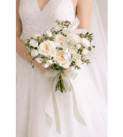 Rustic Whites Bridal Bouquet. An arrangement by Geni's Florist and Gifts.