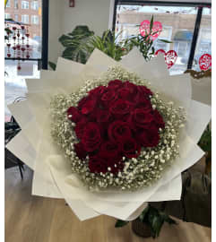 Sunshine Red. An arrangement by Spring Garden Flowers. Sunshine Red. An arrangement by Spring Garden Flowers.