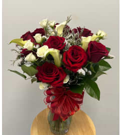 Lovely Reds with Calla Lily. An arrangement by Spring Garden Flowers. Lovely Reds with Calla Lily. An arrangement by Spring Garden Flowers.