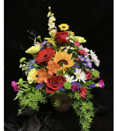 Blooming Brightly. An arrangement by Roma Flowers and Gifts.