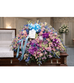 Heavenly Pastel Tribute Casket Spray. An arrangement by Elegant Florist. Heavenly Pastel Tribute Casket Spray. An arrangement by Elegant Florist.