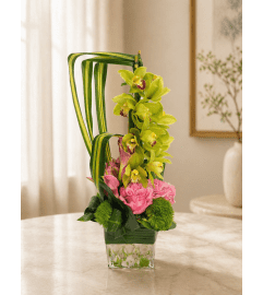 Cymbidium Orchids with Roses. An arrangement by Brickell Glamour Flowers. Cymbidium Orchids with Roses. An arrangement by Brickell Glamour Flowers.