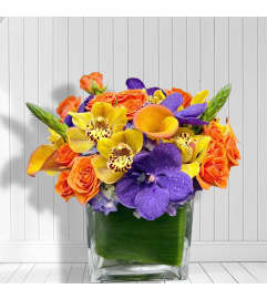 Tropical Sunset Luxe. An arrangement by Elegant Florist. Tropical Sunset Luxe. An arrangement by Elegant Florist.
