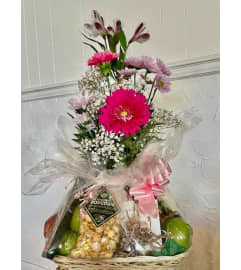 Gourmet Fruit and Flower Basket. An arrangement by Fink Flowers, Gifts and Flower Delivery. Gourmet Fruit and Flower Basket. An arrangement by Fink Flowers, Gifts and Flower Delivery.