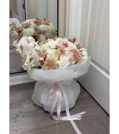 Blush Orchid Garden. An arrangement by Li Flowers.