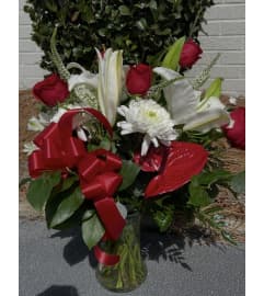 The Anthurium Mix. An arrangement by Seasons Change Designs. The Anthurium Mix. An arrangement by Seasons Change Designs.