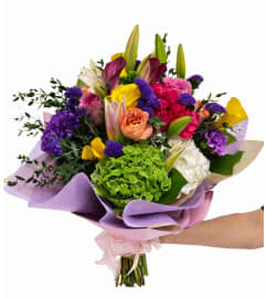 Mix Flower Bouquet Wrap In Vase. An arrangement by Anthurium Gardens Florist. Mix Flower Bouquet Wrap In Vase. An arrangement by Anthurium Gardens Florist.