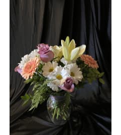 MF Florist's Choice purple. An arrangement by Magic Flowers Inc..