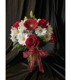 MF Florist's Choice red. An arrangement by Magic Flowers Inc..