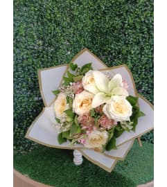 Blushing Beauty Wrapped Bouquet. An arrangement by A Touch of Elegance Florist and Events LLC. Blushing Beauty Wrapped Bouquet. An arrangement by A Touch of Elegance Florist and Events LLC.