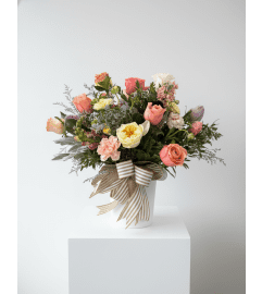 Radiant Spring Harmony. An arrangement by Metcalfe Florist and Pleasant View Greenhouses. Radiant Spring Harmony. An arrangement by Metcalfe Florist and Pleasant View Greenhouses.