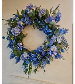 Blue embrace for mom. An arrangement by Yesterday's Florist and Gifts.