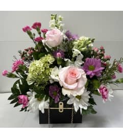 The Blooming Black Chanel Purse. An arrangement by Shalimar Designs.