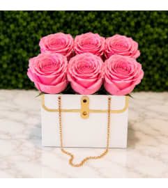 Pink Rose Purse. An arrangement by Cincyfloralnista.