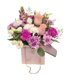 Chic Chanel bag. An arrangement by DMP Flowers and Gifts.