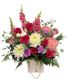 Chanel purse. An arrangement by DMP Flowers and Gifts. Chanel purse. An arrangement by DMP Flowers and Gifts.