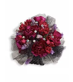 Red Carpet Romance Corsage. An arrangement by Ada's Flowers.