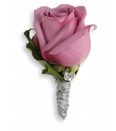 Roses And Ribbons Boutonniere. An arrangement by Ada's Flowers.