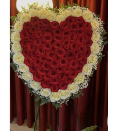 Forever in my heart standing tribute. An arrangement by Tom's Florist. Forever in my heart standing tribute. An arrangement by Tom's Florist.