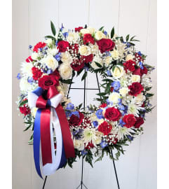 Patriotic Memorial Easel Spray. An arrangement by Block Farms Flowers. Patriotic Memorial Easel Spray. An arrangement by Block Farms Flowers.