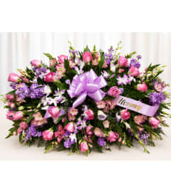 Lavendar Casket Spray. An arrangement by Fink Flowers Gifts and Flower Delivery. Lavendar Casket Spray. An arrangement by Fink Flowers Gifts and Flower Delivery.