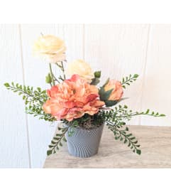 Peach and green silk floral arrangement. An arrangement by Block Farms Flowers.