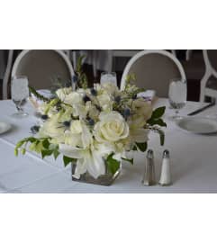 LOW CENTERPIECE FOR 60 ROUND TABLE. An arrangement by Flowers by Priscilla. LOW CENTERPIECE FOR 60 ROUND TABLE. An arrangement by Flowers by Priscilla.
