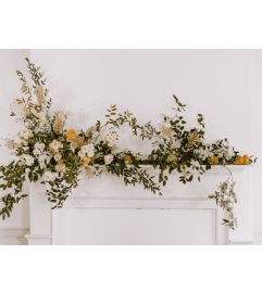 FLOWERS FOR A MANTLE. An arrangement by Flowers by Priscilla.