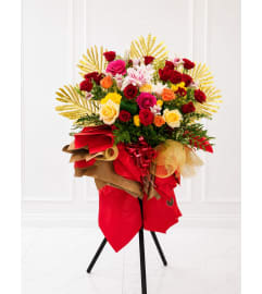 ✨ Celebrate New Beginnings in Grand Style! ✨. An arrangement by Queens Flowers.