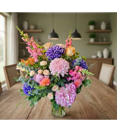 Pink and Purple in a vase. An arrangement by Sophie's Flowers. Pink and Purple in a vase. An arrangement by Sophie's Flowers.