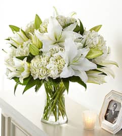 FTD Compassionate Lily Bouquet. An arrangement by Fendley Florists.
