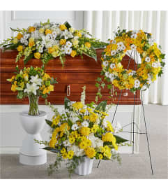 Warm Remembrance Casket Spray Bundle. An arrangement by J.D. Ballantine's Flowers and Gifts.