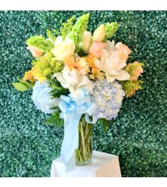 Blushing Blues. An arrangement by Flower World and Gifts.